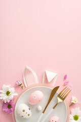 Delightful Easter table arrangement inspiration. Vertical top view of rabbit ears visible from...