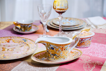 vintage 80 year Old porcelain Dinner set with flowers and butterflies 24 carat Gold