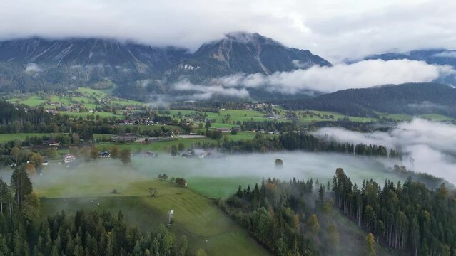 Schladming Austria - Nature Valley Landscape with Clouds and Morning Mist - Aerial 4k