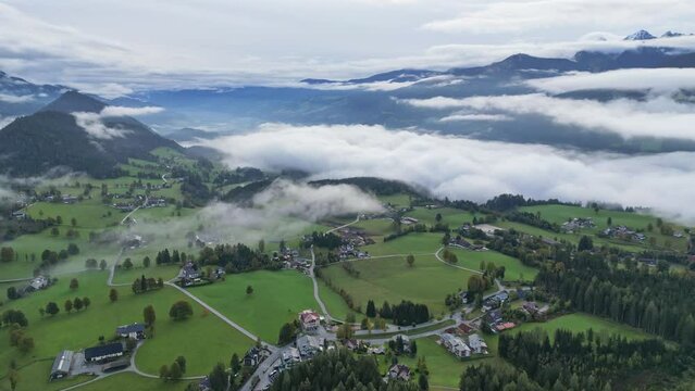 Clouds and Mist at Valley in Schladming Austria - Aerial 4k