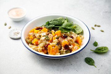 Healthy quinoa bowl with pumpkin and cranberry