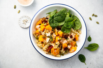 Healthy quinoa bowl with pumpkin and cranberry