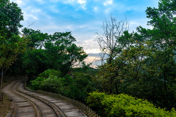 Abandoned train way in the mountain with green plants surrounded, in Jinguashi, New Taipei City, Taiwan.