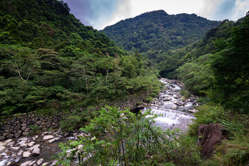 Fototapeta na wymiar Stream go through the valley with many rocks, in Sanxia, New Taipei City, Taiwan.