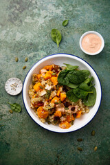 Healthy quinoa bowl with pumpkin and cranberry