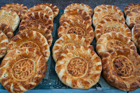 Closeup view of delicious fresh traditional bread known as non aka naan or lepeshka on a market stall, Khujand, Tajikistan