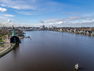 Naklejka premium Netherlands - Beautiful old windmills near Amsterdam on the shore of a lake