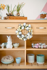Wooden chest of drawers with Easter decorations