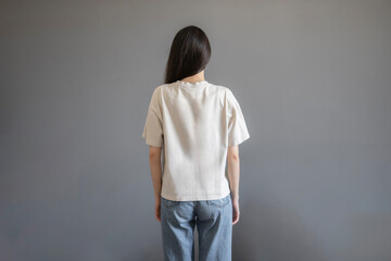 Fototapeta na wymiar Young Woman Posing in a Plain White T-Shirt for a Casual Clothing Mockup