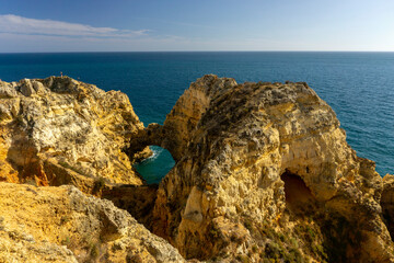 Ponta da Piedade, panoramic view of famous rock formations with arches at sunset, Lagos, Algarve, Portugal.