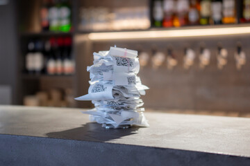 Busy Evening Shift at a Restaurant With Piled-Up Order Tickets on the Counter