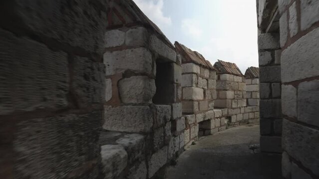 Backward movement of the camera on the historical Yedikule walls in Istanbul. Passing through the trenches in the bastions.