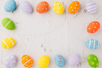 Easter Day Concept. Top view holiday banner background web design white colorful easter eggs painted on white cement background with empty copy space, celebration greeting card, overhead, template