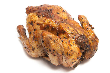 A whole delicious roasted chicken seasoned with herbs isolated on white background clipping path