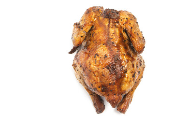 A whole delicious roasted chicken seasoned with herbs top view isolated on white background clipping path
