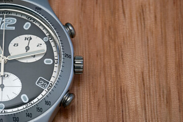 chronograph wrist watch on wood