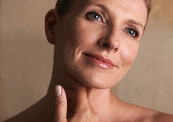 Woman, mature and proud with skincare, treatment and cosmetic for confidence. Senior, tile and...