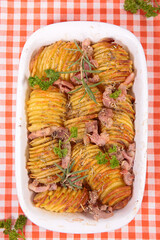 baked sliced potatoes and bacon