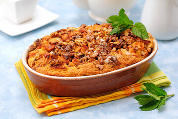 Sponge cake with apple and walnuts.