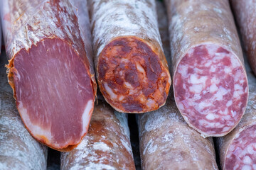 Appetizing acorn-fed Iberian pork loin sausage, Iberian salchichon and Iberian chorizo for sale in street markets in Extremadura.