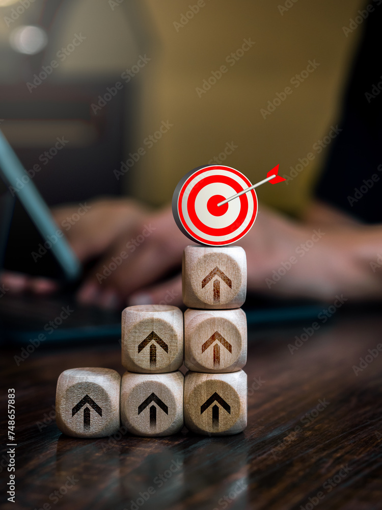Poster 3d target symbol on wooden cube blocks stack as graph steps with upward arrow sign, business person 