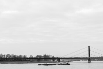Fototapeta na wymiar Cargo boat on the river Rhine in Düsseldorf, Germany