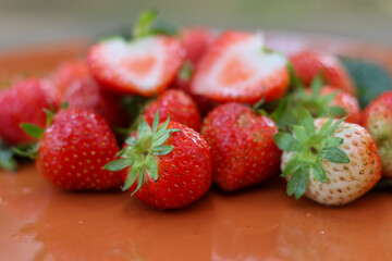 selective focus bright red strawberries on a ceramic plate, looks delicious, lots of strawberries in the plate Eat for health