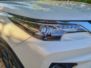 headlight of modern prestigious car close up.