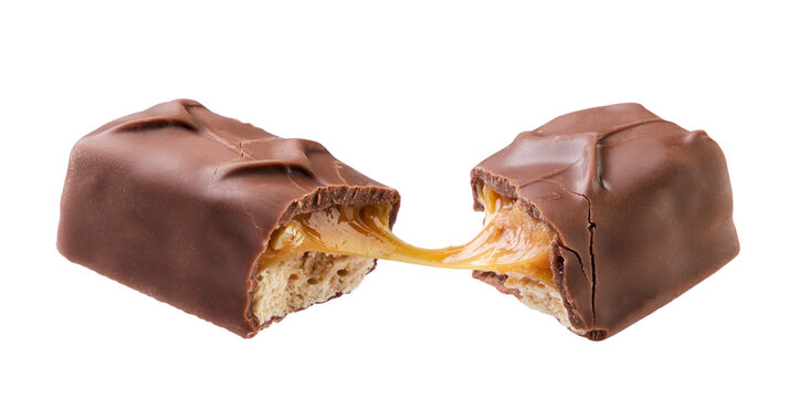 Chocolate bar with caramel and nuts broken in half flies close-up on a white background. Isolated