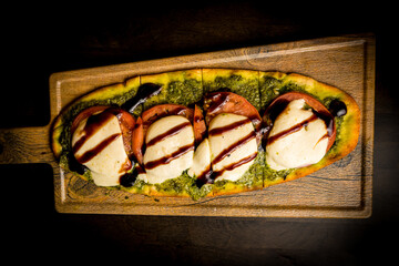 Tomato, mozzarella and pesto flatbread
