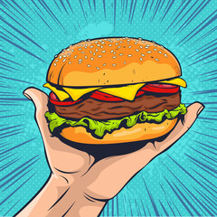 Burger on hand. Fast food illustration in pop art retro comic style.