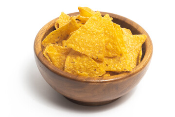 Crispy corn tortilla nachos chips in a wooden bowl isolated on white background clipping path