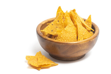 Crispy corn tortilla nachos chips in a wooden bowl isolated on white background clipping path