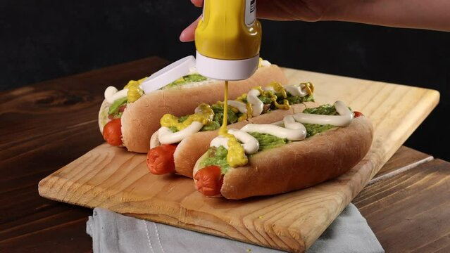 Chilean Typical Completo Food Hot dog with tomato, avocado palta and mayonnaise Selective Focus.