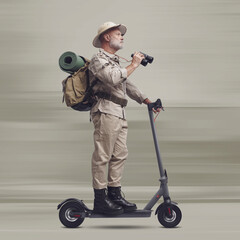 Explorer riding a scooter and holding binoculars