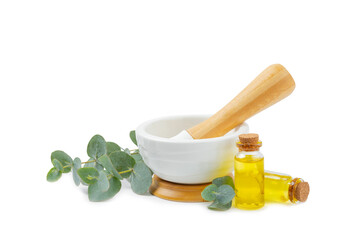 Eucalyptus leaves and mortar isolated on white background.Spa concept.Ingredients for alternative medicine and natural cosmetics. A bottle of essential oil and a bunch of eucalyptus. Organic skin care