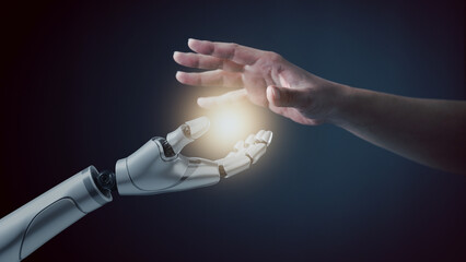 Robot hand touch human hand, the concept of using artificial intelligence technology or Machine learning