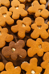 Making Festive Gingerbread Sandwiches on Rustic Wooden Table