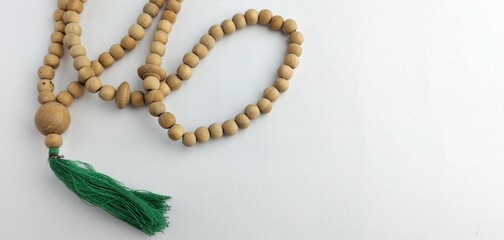 prayer beads from a wooden beads on a white background