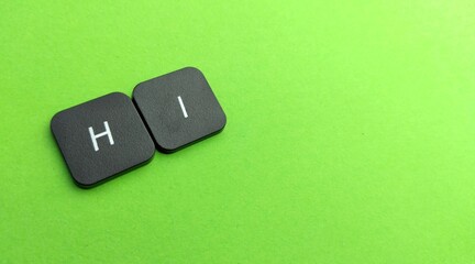 word hi keyboard on green background