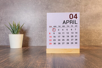 April 1st. Image of april 1 wooden color calendar on white background. Spring day, empty space for...
