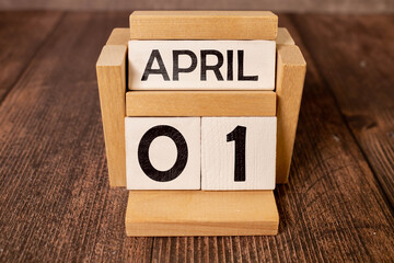 April 1st. Image of april 1 wooden color calendar on white background. Spring day, empty space for text. All Fool's Day