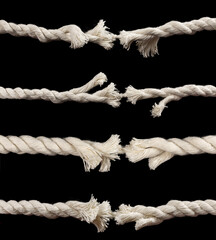 danger and risk with two ends of a frayed worn rope held together by the last strand on the point of snapping, - obrazy, fototapety, plakaty