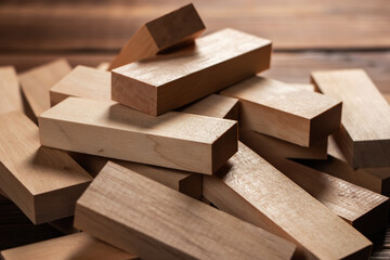 Heap of wooden blocks tower game on wood background