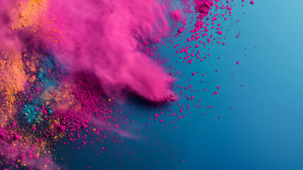 Vibrant colorful splattered pink pigment powders on blue background at the left side of image. Suitable for Holi festival presentations or banner design.