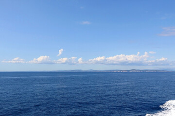 Bright blue sea and clear sky. Copy space.