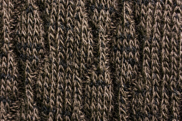 Cosy background or backdrop in textured warm brown textile material. Cotton and wool. Vertical fibres. Photo. Macro