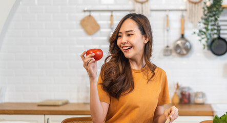 Portrait of beauty health asian woman having fun hold tomato cooking, vegan food healthy eat, fresh...