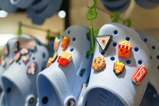 Kuala Lumpur, Malaysia - 12 FEB 2024: Close up Jibbitz accessories on Crocs shoes, they aren't just decorations; they're a way to express yourself, adding creativity and personality to your footwear.