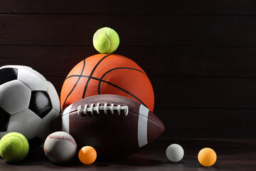 Many different sport balls on wooden background, space for text